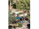 A view of a community pool with tables, chairs, and umbrellas at 270 E Flamingo Rd # 433, Las Vegas, NV 89169