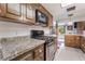 Bright kitchen with stylish countertops, wooden cabinetry, and modern appliances offering an efficient cooking environment at 2967 Pinehurst Dr, Las Vegas, NV 89109