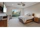 Modern bedroom boasting recessed lighting, a ceiling fan, and a tranquil view from the window at 3018 Fall Solstice Ct, Las Vegas, NV 89138