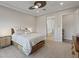 Neutral bedroom with a ceiling fan, carpeted floors, recessed lights, and a tranquil view from the window at 3018 Fall Solstice Ct, Las Vegas, NV 89138