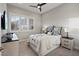 Cozy bedroom features a ceiling fan, plush carpeting, and a serene window view at 3018 Fall Solstice Ct, Las Vegas, NV 89138