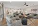 Spacious living area connects to the kitchen, featuring a large seating area and modern decor at 3018 Fall Solstice Ct, Las Vegas, NV 89138