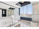 Luxurious bathroom with a soaking tub, a separate shower, and a scenic city view from large windows at 322 Karen Ave # 2501, Las Vegas, NV 89109