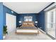 Well-lit bedroom with a walk-out balcony and comfortable neutral toned accents at 322 Karen Ave # 2501, Las Vegas, NV 89109