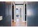 Hallway view leading to a bathroom with tile flooring and bright natural light at 322 Karen Ave # 2501, Las Vegas, NV 89109