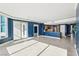 Spacious open-concept living area with tile flooring, blue accent walls, and plenty of natural light at 322 Karen Ave # 2501, Las Vegas, NV 89109