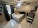 Bedroom features include window, tile flooring, and a ceiling fan at 3230 Cameron St # A, Las Vegas, NV 89102