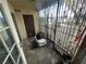 Enclosed patio area with metal security bars and a electric car at 3230 Cameron St # A, Las Vegas, NV 89102