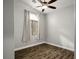 Serene bedroom with wood flooring, a vaulted ceiling, and a large window with natural light at 3334 Flying Colt Ct, North Las Vegas, NV 89032