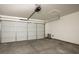 Spacious two-car garage featuring an automatic door and ample room for storage and vehicles at 3334 Flying Colt Ct, North Las Vegas, NV 89032