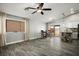 Bright living area with tile floors, ceiling fan, and dining area with slider to backyard at 3334 Flying Colt Ct, North Las Vegas, NV 89032