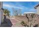 Backyard brick wall surrounding desert landscaping with comfortable seating at 3640 Chateau Meadow St, Las Vegas, NV 89129