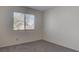 Bedroom featuring carpeting, neutral paint, and natural light from the window at 3640 Chateau Meadow St, Las Vegas, NV 89129