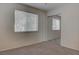 This bedroom features neutral carpet, bright natural light, and a mirrored closet at 3640 Chateau Meadow St, Las Vegas, NV 89129