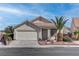 Charming single-story home featuring a two-car garage, desert landscaping, and a welcoming front porch at 3640 Chateau Meadow St, Las Vegas, NV 89129