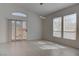 Bright living room featuring tile floors and a sliding glass door at 3640 Chateau Meadow St, Las Vegas, NV 89129