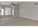 Spacious, carpeted living room featuring large windows, vaulted ceilings, and natural light at 3640 Chateau Meadow St, Las Vegas, NV 89129