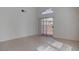 Bright living room featuring tile flooring, high ceilings and sliding door access to back yard at 3640 Chateau Meadow St, Las Vegas, NV 89129