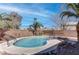 Backyard pool surrounded by desert landscaping, a brick wall and comfortable seating at 3640 Chateau Meadow St, Las Vegas, NV 89129