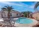 Inviting backyard pool with comfortable seating area and desert landscaping, perfect for outdoor relaxation at 3640 Chateau Meadow St, Las Vegas, NV 89129