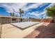 Backyard with a covered pool, gravel landscaping, and covered patio at 4409 Cinderella Ln, Las Vegas, NV 89102