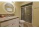 An interior bathroom area featuring a tile floor, a vanity mirror, and a standing shower at 4409 Cinderella Ln, Las Vegas, NV 89102