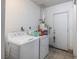 Laundry room with tiled floor, washer, dryer, and utility sink at 4409 Cinderella Ln, Las Vegas, NV 89102