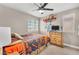 Bedroom featuring neutral walls, carpet flooring, a ceiling fan, and a window at 4822 Jade Ridge St, North Las Vegas, NV 89081