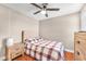 Bedroom featuring wood flooring, a ceiling fan, and a queen bed, offering a relaxing retreat at 4822 Jade Ridge St, North Las Vegas, NV 89081