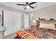 Bedroom with carpet, ceiling fan, closet and view of another room, offering ample space at 4822 Jade Ridge St, North Las Vegas, NV 89081