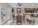 Bright dining area with french doors, stylish furniture, and open view to the kitchen, perfect for everyday meals and gatherings at 4822 Jade Ridge St, North Las Vegas, NV 89081