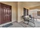 Welcoming front porch with seating area and decorative accents at 4822 Jade Ridge St, North Las Vegas, NV 89081