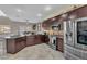 Modern kitchen featuring stainless steel appliances, dark cabinetry, and stylish backsplash, ideal for cooking and entertaining at 4822 Jade Ridge St, North Las Vegas, NV 89081