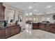 Open kitchen overlooking the living area, featuring granite countertops, stainless steel appliances, and ample cabinet space at 4822 Jade Ridge St, North Las Vegas, NV 89081