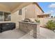 Well-equipped outdoor kitchen with built-in grill and countertop space, perfect for entertaining at 4822 Jade Ridge St, North Las Vegas, NV 89081