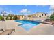 Stunning in-ground pool with a built-in spa and beautifully landscaped backyard at 4822 Jade Ridge St, North Las Vegas, NV 89081