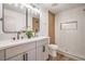 Updated bathroom featuring double sinks, modern fixtures, and a beautifully tiled shower with a built-in niche at 4954 Palmyra Ave, Las Vegas, NV 89146