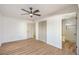 Bedroom with fan and view to remodeled bathroom through the open entry at 4954 Palmyra Ave, Las Vegas, NV 89146