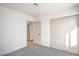 Neutral bedroom with closet, fresh carpet, and adjacent bathroom at 4954 Palmyra Ave, Las Vegas, NV 89146