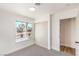 Bedroom featuring fresh carpet, closet, and a view of the neighborhood at 4954 Palmyra Ave, Las Vegas, NV 89146