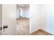 Hallway showcasing light wood flooring leading to a bedroom or living space at 4954 Palmyra Ave, Las Vegas, NV 89146