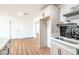 Well-lit kitchen features white cabinets, stainless appliances, a breakfast bar, and an open layout at 4954 Palmyra Ave, Las Vegas, NV 89146