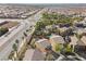 Aerial view of the neighborhood and a landscaped backyard with a built-in pool at 511 Via Ripagrande Ave, Henderson, NV 89011