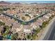 Neighborhood aerial view featuring serene streets, verdant landscaping, and convenient access to nearby amenities at 511 Via Ripagrande Ave, Henderson, NV 89011