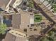 Aerial view of a property featuring a backyard with a putting green and covered patio area at 511 Via Ripagrande Ave, Henderson, NV 89011