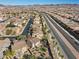 Expansive aerial view of a residential community, highlighting the neighborhood layout and mountain views at 511 Via Ripagrande Ave, Henderson, NV 89011