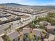 An aerial shot overlooking the neighborhood and a landscaped backyard with a built-in pool at 511 Via Ripagrande Ave, Henderson, NV 89011