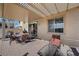 View of the covered back patio featuring brick pavers and outdoor seating at 511 Via Ripagrande Ave, Henderson, NV 89011