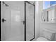 Modern bathroom featuring a glass-enclosed shower with a built-in seat at 511 Via Ripagrande Ave, Henderson, NV 89011