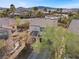 An aerial view of a two-story home showcasing desert landscaping, tile roof and a blue sky at 511 Via Ripagrande Ave, Henderson, NV 89011